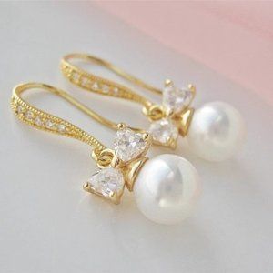 White Pearl Dangle Earrings, Gold Finish, Diamond CZ Bow Accents